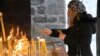 A member of the Serbian Orthodox Church attends a service during Orthodox Christmas Eve celebrations in Cetinje, Montenegro, January 6. The Montenegrin Orthodox Church also held an event in the town on the same day just a few hundred meters away. 