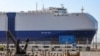 The MV Helios Ray cargo ship is seen docked in Dubai on February 28.