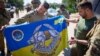 Президент України Володимир Зеленський (праворуч) під час зустрічі на Донеччині з бійцями Сил спеціальних операцій ЗСУ, 29 липня 2023 року