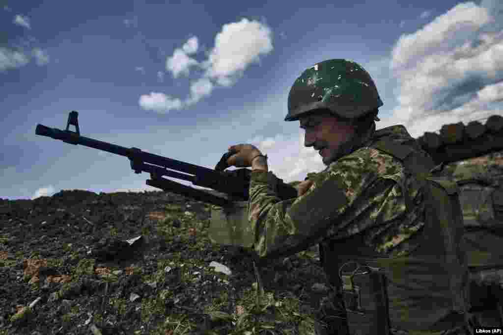 A Ukrainian soldier near the front line in Bakhmut. The 15 months of trench warfare have been described as a "meat grinder" by Prigozhin. Though military experts say the city has little strategic value, it has taken on great symbolic importance for both Kyiv and Moscow. 