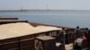 A barge carrying Ukrainian grain is moored for unloading at a port in Romania. (file photo)