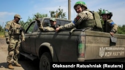 Ukrainian soldiers are seen near the front line in the village of Neskuchne in Ukraine's Donetsk region, newly liberated from the Russian Army, on June 13.