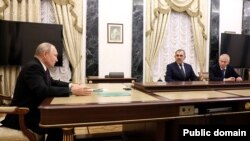 Russian President Vladimir Putin meets with Deputy Defense Minister Yunus-Bek Yevkurov and former Wagner senior commander Andrei Troshev (right). 