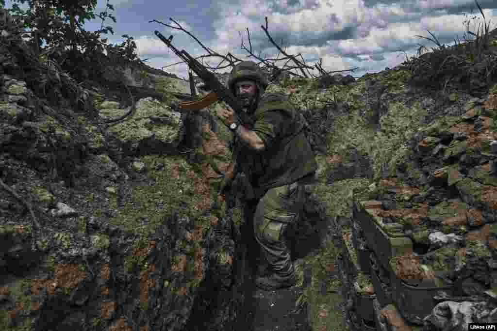 A Ukrainian soldier engages Moscow's forces from his trench position near Bakhmut in the Donetsk region on May 22. Fighting for control of the city has continued despite claims by Russia that it has fallen to the Kremlin's troops. 