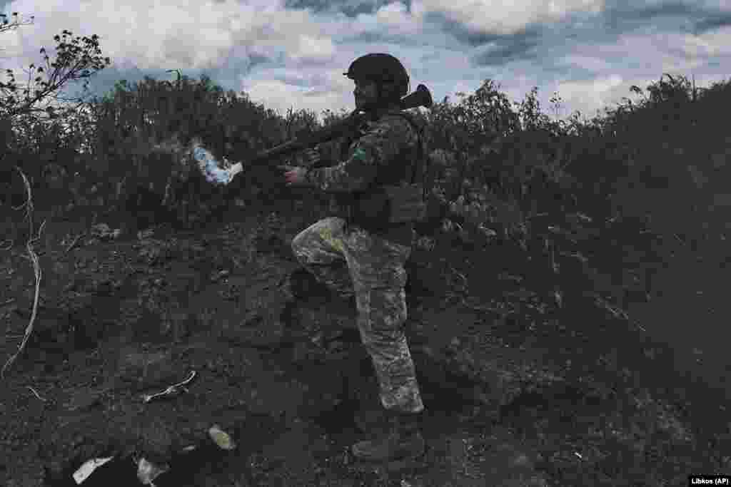 A Ukrainian soldier fires a rocket-propelled grenade (RPG) toward Russian positions. On May 23, Ukraine's Deputy Defense Minister Hanna Malyar said on the Telegram messaging app that Ukrainian forces still controlled the southwestern edge of Bakhmut.