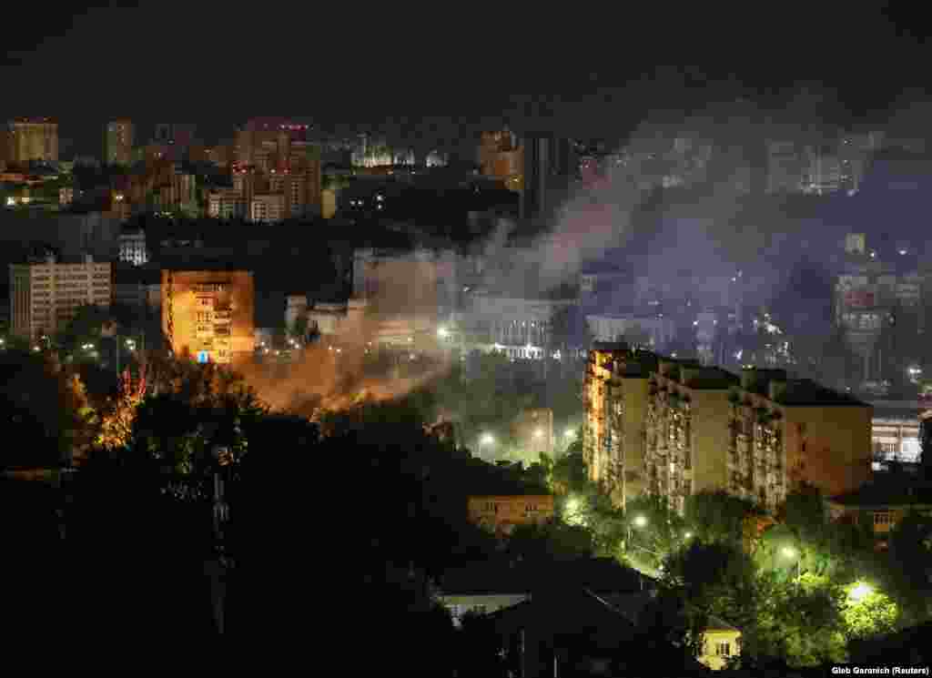 Smoke rises above Kyiv following the drone attack. Klitschko also said two people were injured when debris damaged an apartment building in the Darnytskiy district.
