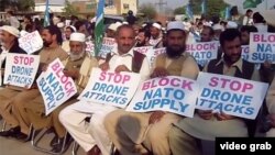 Members of the Islamist party Jamat-e Islami protest in Peshawar against U.S. drone strikes and call for a blockade of NATO supplies on November 8. 