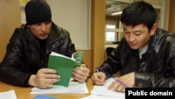 Russia -- Migrants in Russia take an exam in Russian language