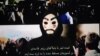 In the video message, which reportedly played on the Telewebion streaming platform, a masked man appears and a muffled voice says the Iranian regime “will no longer silence us.”