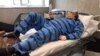 Jailed Iranian poet Baktash Abtin is pictured after being hospitalized in July 2021.