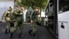 Russian recruits take a bus near a military recruitment center in Krasnodar on September 25, 2022. Hundreds of thousands of men have fled Russia to avoid the Moscow-launched war in Ukraine since last year. 