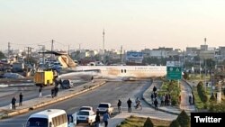 The plane made a hard landing and skidded onto a nearby highway.