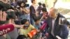 Tungyshbai Zhamanqulov speaks to reporters after his trial in Almaty on June 1.