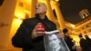 Mikalay Statkevich attends a rally to commemorate victims of Stalin's political repressions outside KGB headquarters in Minsk on October 29.