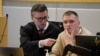 Wagner defector Andrei Medvedev (right) attends an an Oslo district court hearing accused of having participated in a fight outside a pub in the center of Oslo and of violence against the police on April 25.