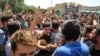 The protest came a day after demonstrators forced two major mobile-phone and electronics shopping centers in Tehran to close.