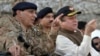 Pakistani Prime Minister Nawaz Sharif (right) speaks with military chiefs as they watch an exercise in November 2013.