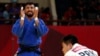 Mohammad Mohammadi Barimanlou of Iran celebrates his win over Kim Chol Gwang of North Korea in a bout in Jakarta last month.