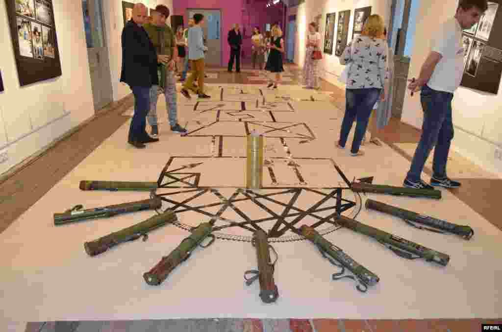 The photo exhibition took place at the Izolyatsia arts center, formerly located in Donetsk. The center relocated to Kyiv after separatist fighters seized its exhibition space and destroyed many of the artworks displayed there.