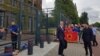 Kosovar President Hashim Thaci (center) leaves the prosecutor's office in The Hague on July 16.