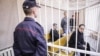 Юры Паўлавец, Дзьмітры Алімкін і Сяргей Шыптэнка на лаве падсудных