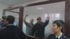 Activists Maks Boqaev (right) and Talghat Ayan in the courtroom in Atyrau on October 28