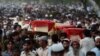 Relatives and residents carry the coffins of bomb victims during a funeral procession of victims of a Peshawar bombing in late September.