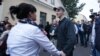 Opposition activist Zmitser Dashkevich greets relatives, including wife Nasta, and well-wishers on after his release from prison early on August 28.