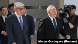 Nursultan Nazarbaev (right) and handpicked successor Qasym-Zhomart Toqaev attend the Astana Economic Forum in Nur-Sultan in May 2019.