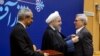 Abdolrasoul Dorri Esfahani (right) was honored by President Hassan Rohani on February 8, 2016, for his role in the landmark nuclear negotiations.