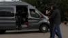 Belarusian law enforcement officers detain a journalist in central Minsk on August 27.