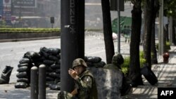 Бангкоктогу көчө уруштарынан бир көрүнүш. 15-май, 2010-ж.