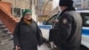 Aigul Otepova is shown as she is removed from her apartment before being taken to a psychiatric clinic in Nur-Sultan on November 23.