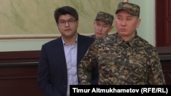 Former Kazakh Economy Minister Quandyq Bishimbaev at his trial in Astana on January 8.