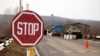 Moldova - STOP road sign, checkpoint of peacekeeping troops, Vadul lui Voda, the bridge over the Dniester River, 09Jan2012