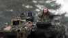 German Defense Minister Boris Pistorius (right) sits in a Leopard 2 tank in Augustdorf, Germany, on February 1.