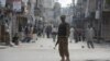 A soldier keeps watch during a curfew in Rawalpindi on November 16. The curfew was imposed after deadly clashes erupted there last week. 