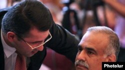 Armenia -- Armen Martirosian of the Zharangutyun Party (L) talks to its top leader, Raffi Hovannisian, during a party congress, 10July 2010.