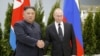 Russian President Vladimir Putin (right) and North Korea's Kim Jong Un shake hands during their meeting in Vladivostok, Russia, in April 2019.