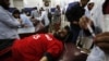 PHOTO GALLERY: A string of bombings kills scores in Pakistan. 