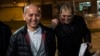 Kazakh opposition figure and oligarch Mukhtar Ablyazov (left), flanked by his lawyers, reacts as he leaves the Fleury-Merogis jail after being released, near Paris, in December 2016.