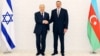 Azerbaijani President Ilham Aliyev (right) welcomes his Israeli counterpart, Shimon Peres, in Baku in June 2009.