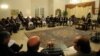 Pakistani Prime Minister Raja Pervez Ashraf (top right) talks with Afghan parliament members during a meeting in Islamabad on December 11.
