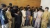 Police produce young children suspected of planting bombs to the media in Quetta on March 13.