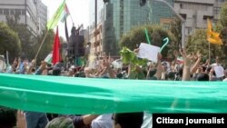 Иран оппозициясынын лидери Мир Хусейн Мусавинин тарапкерлери Кудус күнү болгон демонстрацияда.