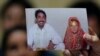 Farzana Parveen's sister Khalida holds up a picture of Farzana during a press conference in Lahore on May 31.