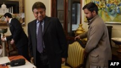 In this photograph taken on December 29, Pakistan's former military ruler Pervez Musharraf (center) leaves after addressing foreign media representatives at his farmhouse in Islamabad.