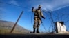 A soldier creates a barrier using barbed wire at a security checkpoint in the Swat valley region. (file photo)