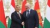 Belarusian President Alyaksandr Lukashenka (right) and Hungarian Prime Minister Viktor Orban pose for a photo during their meeting in Minsk on June 5. 