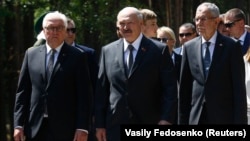 Belarusian President Alyaksandr Lukashenka (center) flanked by German President Frank Steinmeier (left) and Austrian President Alexander Van der Bellen (right) attend an unveiling ceremony for a monument to the victims of World War II on the grounds of the former Nazi concentration camp in Trostenets on June 29. 